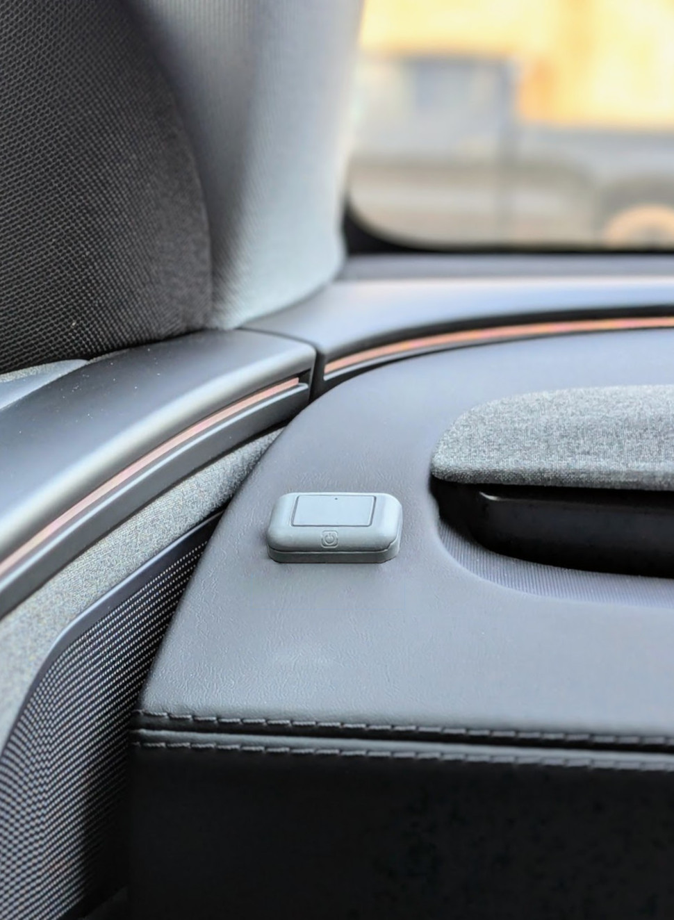 Button on Tesla driver door panel